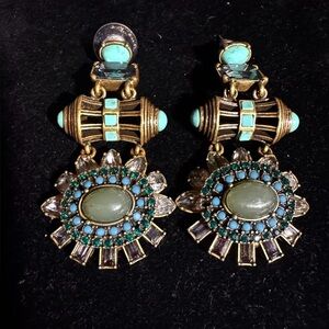 Vintage inspired earrings feature stones sparkling crystals for a timeless look.